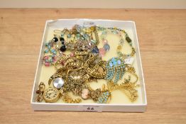 An assorted collection of costume jewellery, to include a continental Solora fob watch on yellow