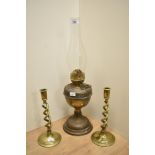 A late 19th Century brass Duplex oil lamp, with chimney, measuring 52cm tall, and a pair of twist