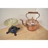 A 19th Century copper fireside kettle and a brass kettle stand with cast iron base