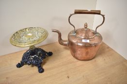 A 19th Century copper fireside kettle and a brass kettle stand with cast iron base