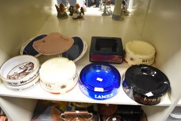 An assorted collection of ten vintage pub ashtrays, including Slalom D, Bell's Old Scotch Whisky,