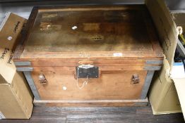 A vintage wooden trunk, metal bound, and with key, measuring 41cm x 60cm x 43cm overall