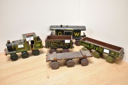 A 20th Century novelty wooden locomotive, GWR, together with hand painted coach and wagons