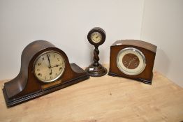 An early 20th Century oak cased mantel clock, of Napoleon's Hat shape, having a silvered arabic