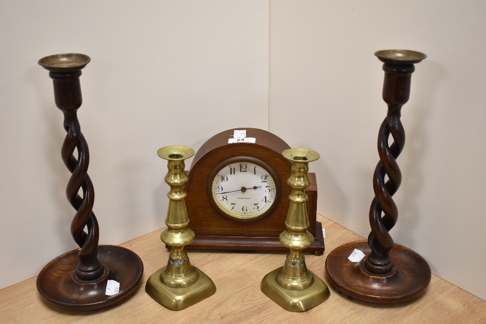 An Edwardian mahogany inlaid mantel clock, of domed form, having an enamelled arabic dial, eight day