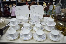 An early 20th Century Heathcoate china tea set, decorated with a hand coloured foliate design