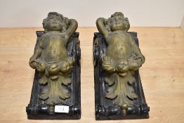 A pair of 19th Century giltwood corbels, modelled as Putti, and measuring 28cm tall