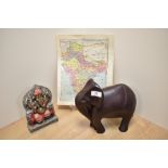 A contemporary resin sculpture of a stylised elephant, measuring 22cm tall, an ethnic and painted