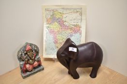 A contemporary resin sculpture of a stylised elephant, measuring 22cm tall, an ethnic and painted