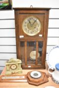 An early 20th century oak cased wall clock, an onyx mantel clock and a barometer.