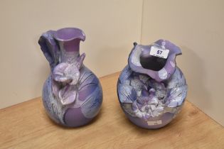 A studio pottery floral encrusted vase, of rounded form, and drip glazed on a lilac ground,