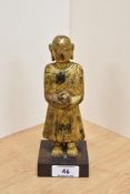 An interesting 19th Century gilt and lacquered standing Shan monk figure, holding an alms bowl,
