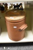 A vintage stoneware lidded crock pot