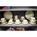 A collection of circa 1912 Royal Worcester table ware, having green and cream ground with brown swag