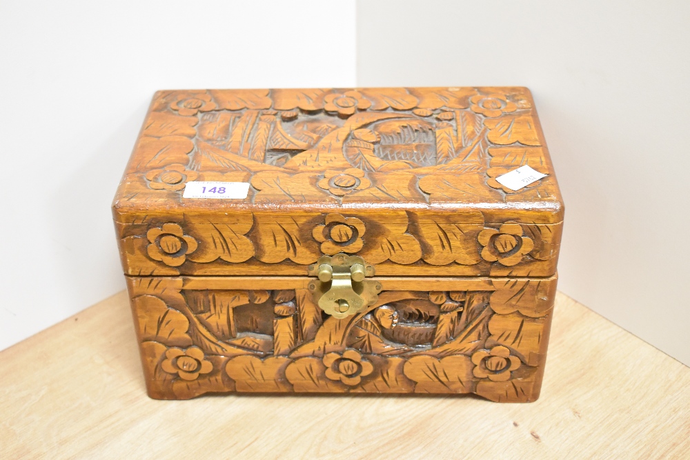 A mid-20th Century Chinese carved camphor wood box, measuring 15cm x 15cm x 25cm