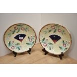 Two Victorian Majolica plates, having moulded decoration of basket weave, with fan to centre, bees