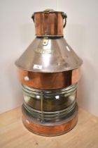 A large Victorian copper and brass ship's masthead lantern, measuring 60cm tall