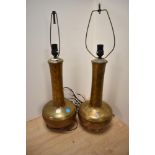 A pair of attractive 20th Century bottle shaped lamp bases, lustre coloured and with patinated