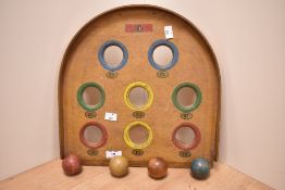 An early 20th Century Chad Valley 'Skee' Ball game, with four balls, measuring 36cm x 36cm