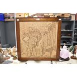 An early 20th Century oak framed fire screen, with integral machined tapestry panel, measuring