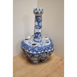 A 19th Century Chinese blue and white porcelain tulip vase, having a flower head terminal over a