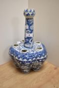 A 19th Century Chinese blue and white porcelain tulip vase, having a flower head terminal over a