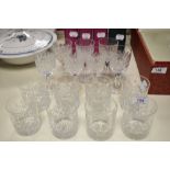 A set of eight cut glass whisky tumblers and seven cordial glasses