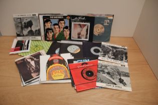 A mixed of 45's - approximately 50 some in company bags , some in pic sleeves with rock , pop and