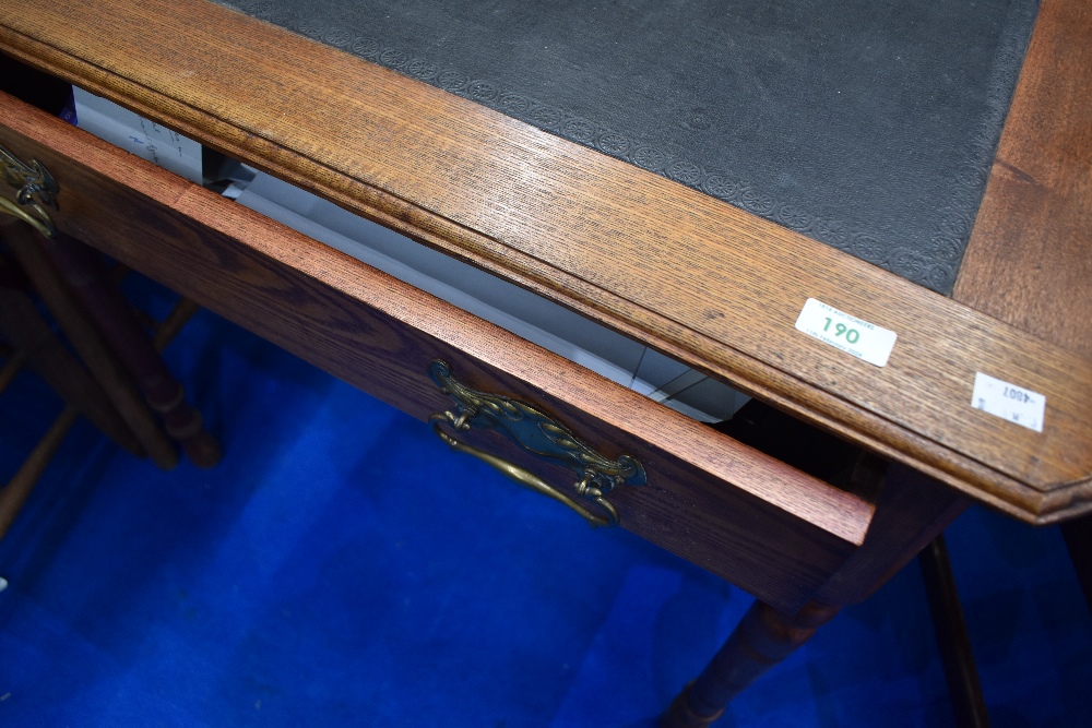 A Victorian oak side table/desk having skiver top, frieze drawer and turned legs, dimensions approx. - Image 2 of 2