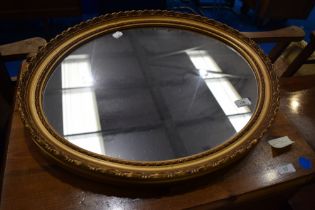 A gilt frame oval wall mirror, approx. 57 x 46cm