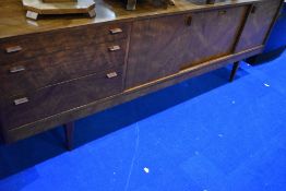 A vintage long john style sideboard with drawers to one side, sliding doors to cabinet and drop flap