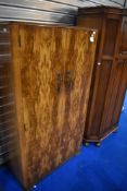 A 1930s walnut Gentleman's wardrobe with typical compartmental interior, dimensions approx. H162 W91