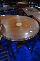 An Edwardian mahogany occasional table having inlaid top (af), diameter approx 62cm