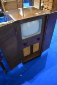 A vintage Bush TV in cabinet