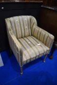 A low armchair having horse hair stuffing and classic upholstery, on bleached or stripped frame,