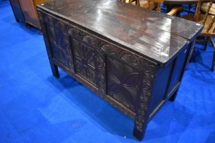 An 18th Century dark oak 3 panel coffer having carved panel to front, dimensions approx. W125 H78