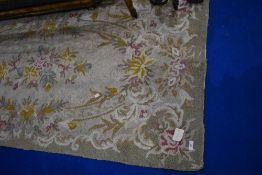 A traditional floral rug, approx 180 x 88cm