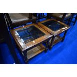 A pair of modern stained frame square occasional tables with glass top and cane undertier, approx 46