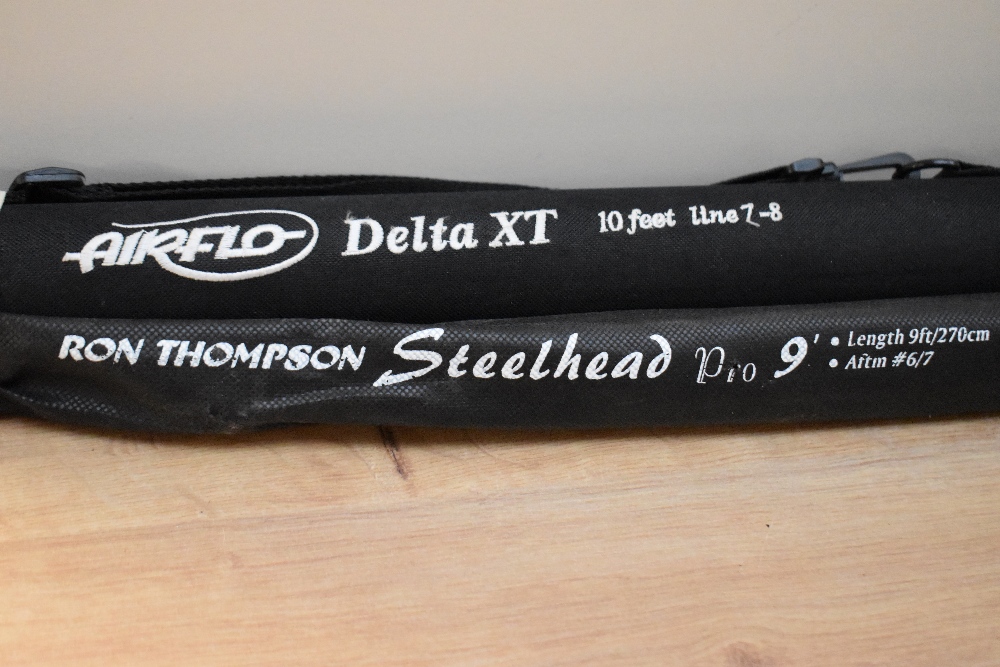 Two fly fishing rods A Ron Thompson Steelhead pro 9ft #6/7 (looks unused) in a soft sleeve. And an