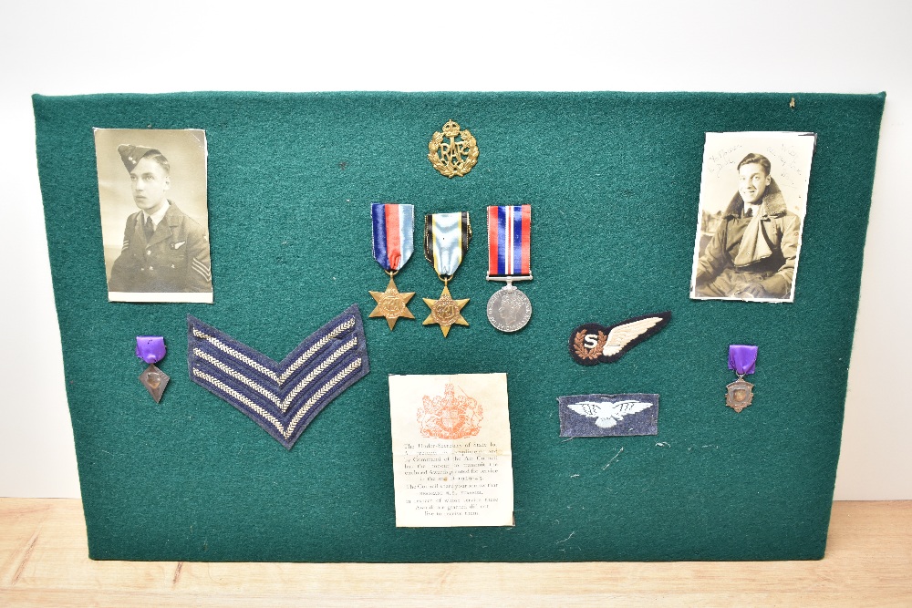 A WWII Medal Group on display board to Sergeant William Stanley Edwards RAF Bomber Command, 1939-