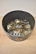 A tin of Military Cap Badges, Cloth Badges and Buttons, many regiments seen including Cheshire,