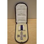 A George V Military Cross in original box with ribbon, unnamed, The Military Cross was instituted in