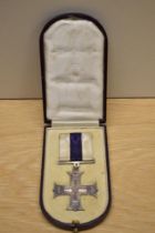 A George V Military Cross in original box with ribbon, unnamed, The Military Cross was instituted in