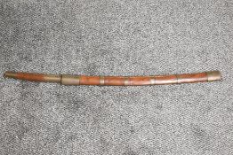 A WWII period Burmese Dha Sword with plain wood and brass hilt, plain wood and brass scabbard, blade