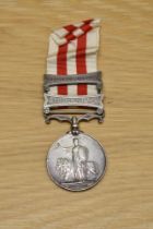 A Queen Victoria Indian Mutiny Medal with two clasps, Lucknow and Relief of Lucknow and ribbon, to