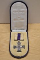 A George V Military Cross in original box with ribbon, unnamed, The Military Cross was instituted in