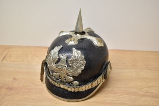 A German leather Pickelhaube Helmet with leather chin strap, numbered 56 and making town of