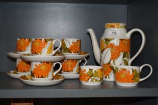 A Mid century Midwinter coffee service, having bright orange floral design on white ground,