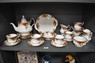 A collection of Royal Albert 'Old Country Roses' including tea pot, cups and saucers, cake plate