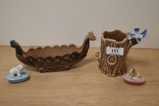 A wade Viking ship and tree trunk spill vase with bluebird and two Wade pencil holders, one with dog
